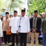 Pj Bupati Langkat Faisal Hasrimy Pimpin Upacara Pelepasan Jenazah Kades Serapuh ABC